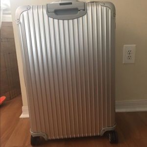 Famous rimowa aluminum Topas 30" suitcase.